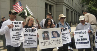 Dr. Aafia Siddiqui escorted from court on first day of trial